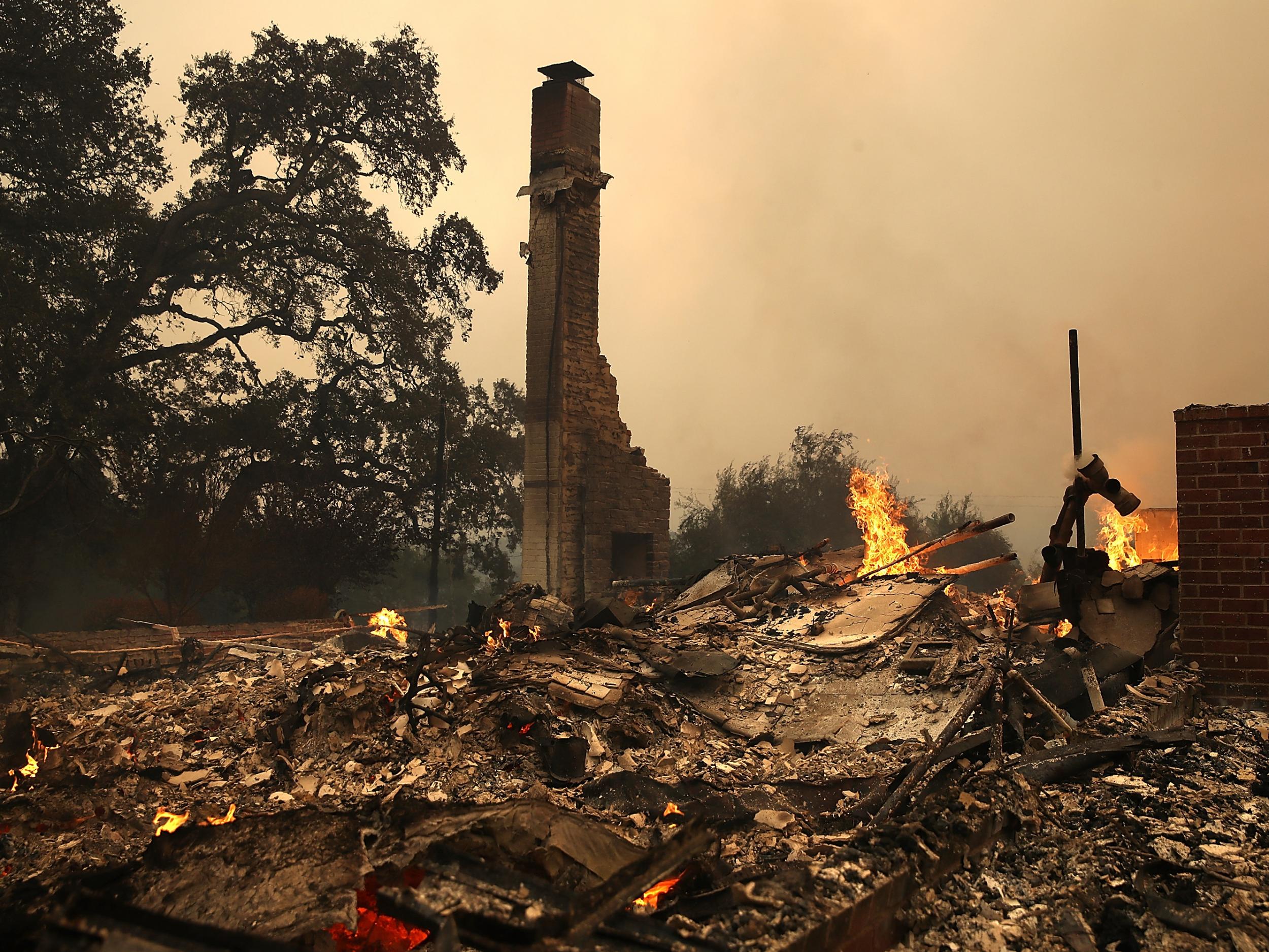 The remains of fire damaged homes after an out of control wildfire moved through the area in California