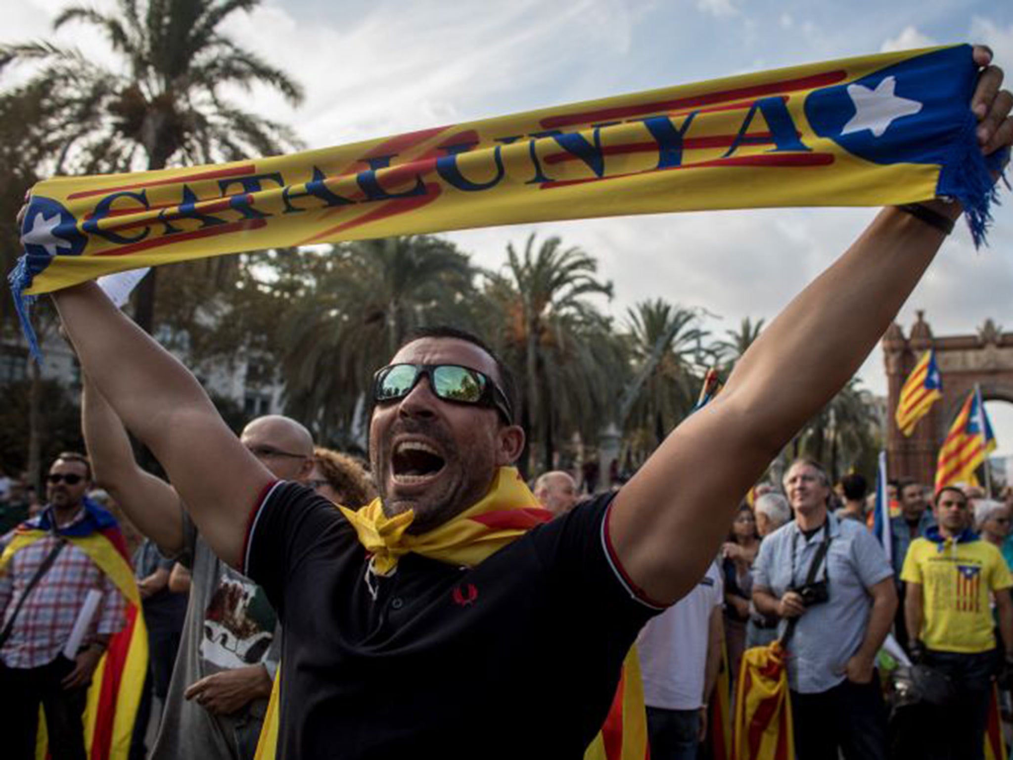 Pro-independence supporters outside the parliament of Catalunya in Barcelona yesterday
