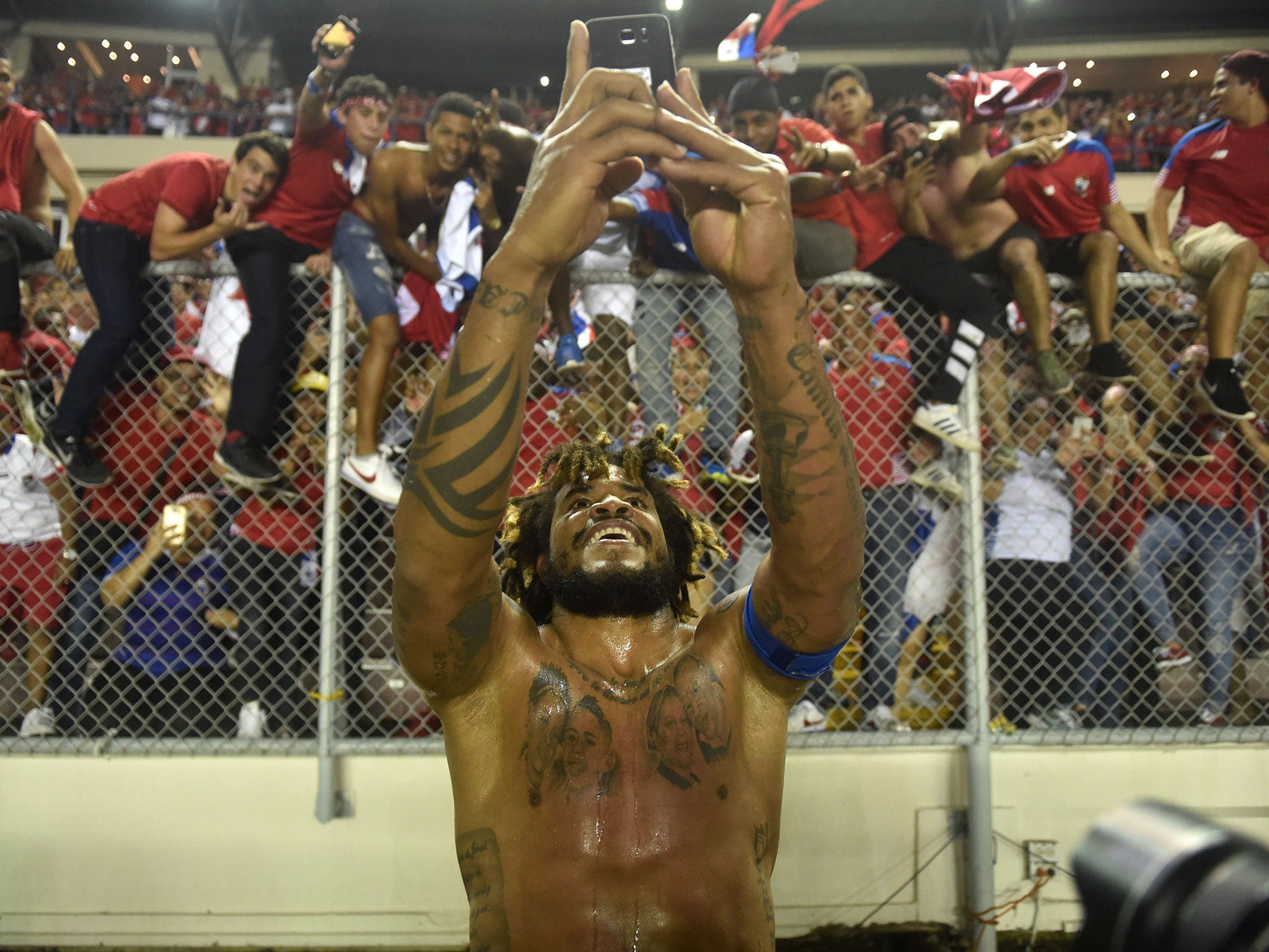 Hero of the night Roman Torres celebrates victory with the Panama fans
