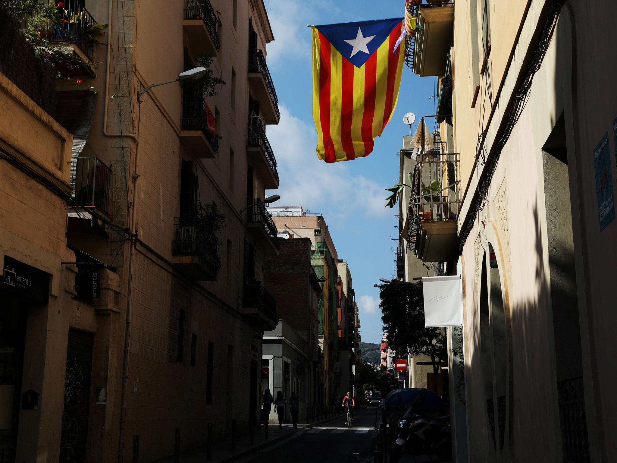 A Catalan separatist flag hangs from a balcony in Barcelona