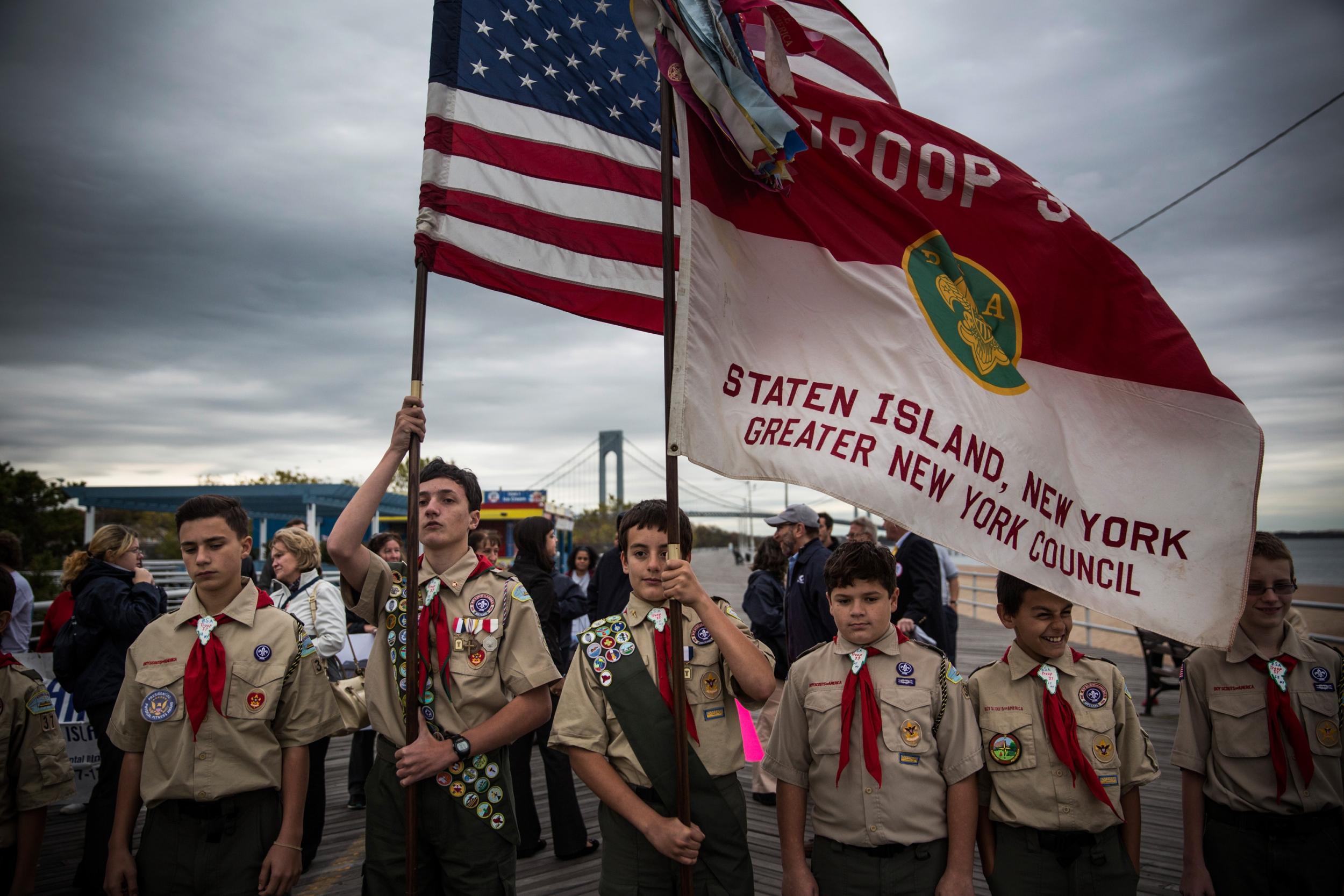 Boy Scouts of Troop 37 prepare to lead a march of Staten Island residents to mark the two year anniversary of Superstorm Sandy's landfall