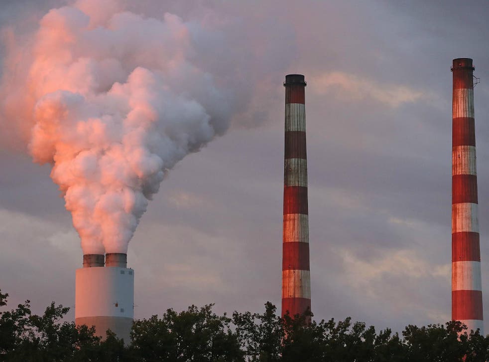 Emissions spew out of a large stack at the coal-fired Morgantown Generating Station on 10 October in Newburg, Maryland.