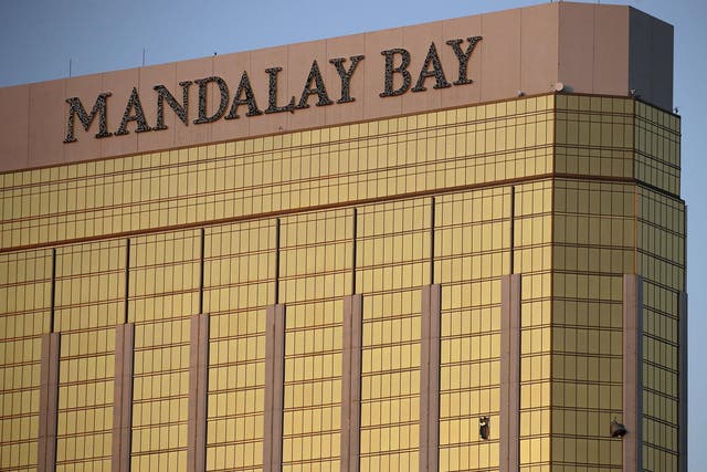 Drapes billow out of broken windows at the Mandalay Bay resort and casino on the Las Vegas Strip, following the deadly shooting at a music festival in Las Vegas