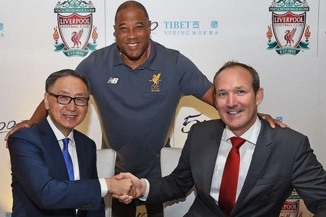 Liverpool legend John Barnes poses with the club's commercial director Billy Hogan and Tibet Water executive director Sunny Wong