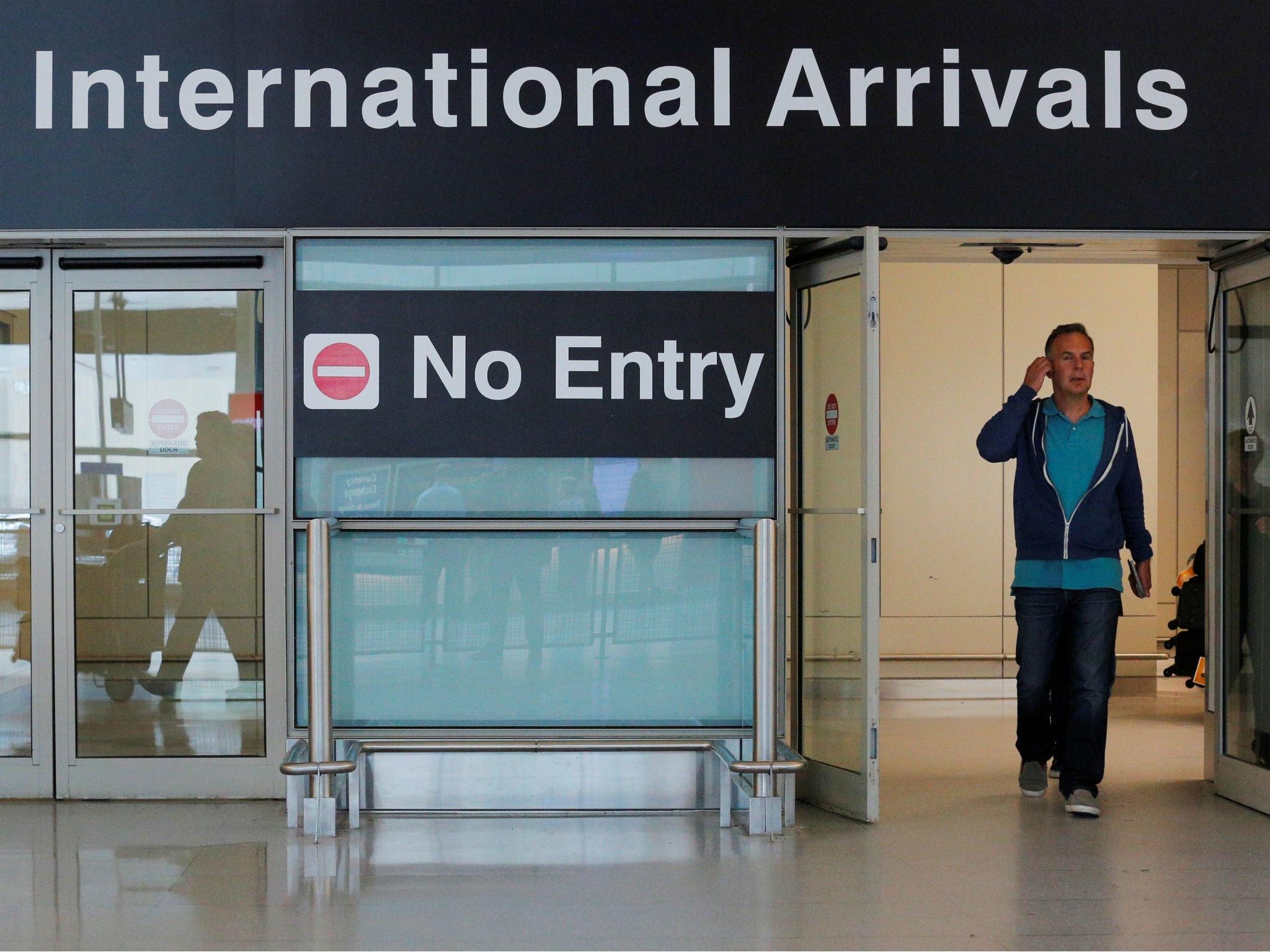 International travelers arrive at Logan Airport in Boston, Massachusetts, on June 29, 2017.