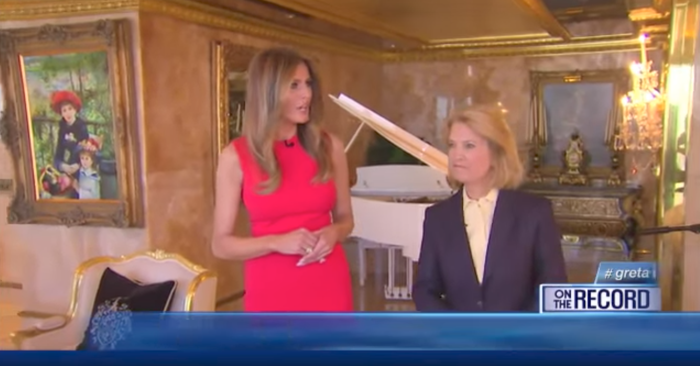 Melania Trump speaks with Fox News - the fake Renoir painting can be seen on the wall in the background