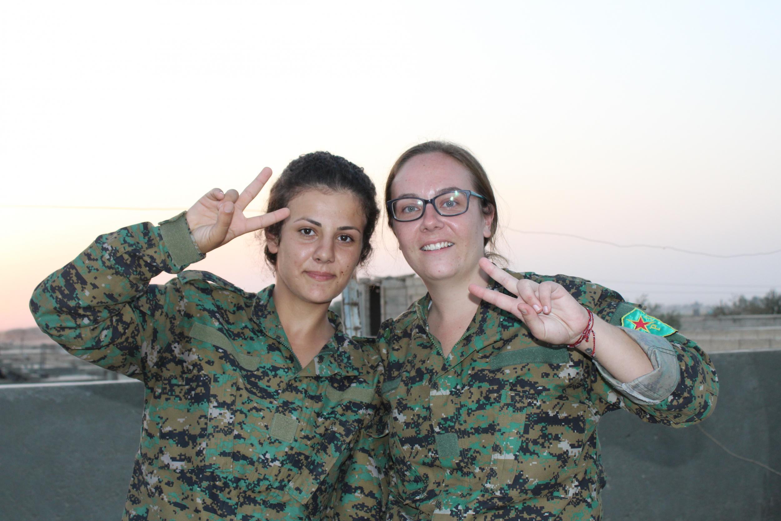 Kimmie and Jianda, a Kurdish member of her unit, at their base in East Raqqa