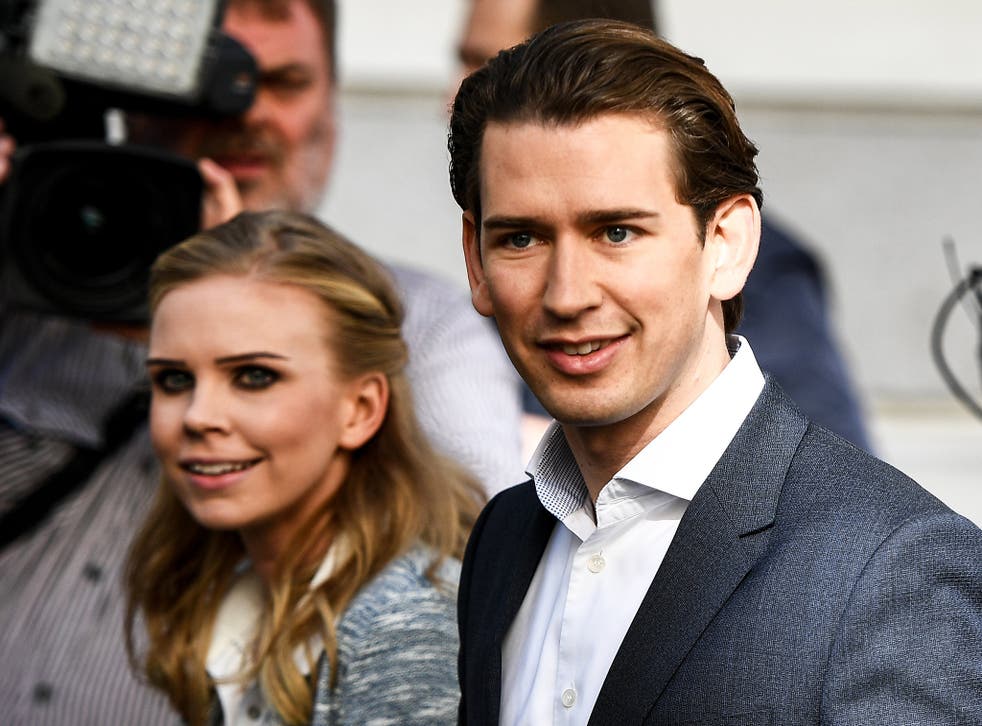 Austrian Peoples Party leader Sebastian Kurz and his girlfriend Susanne Thier cast their votes at a polling station in Vienna