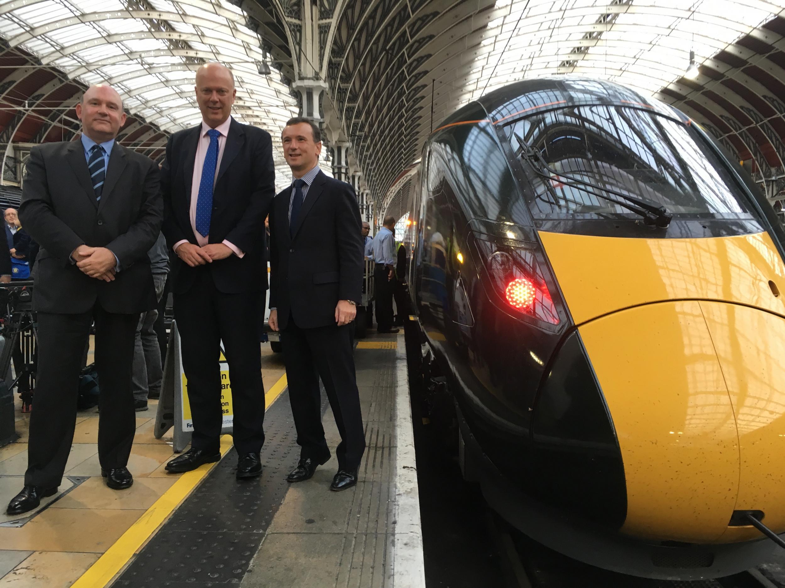 Better late: Transport Secretary Chris Grayling (centre) with the first Intercity Express Train to arrive at London Paddington station