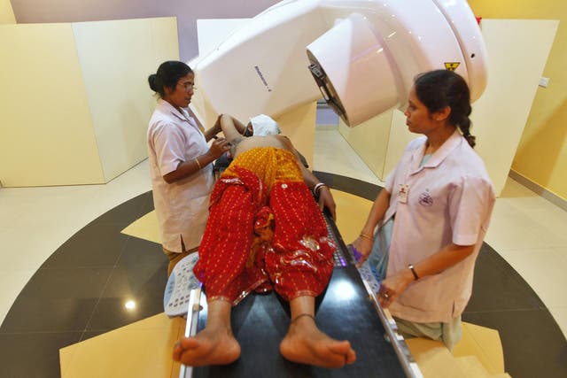 A nurse prepares a breast cancer patient before a gamma-ray test in Kolkata
