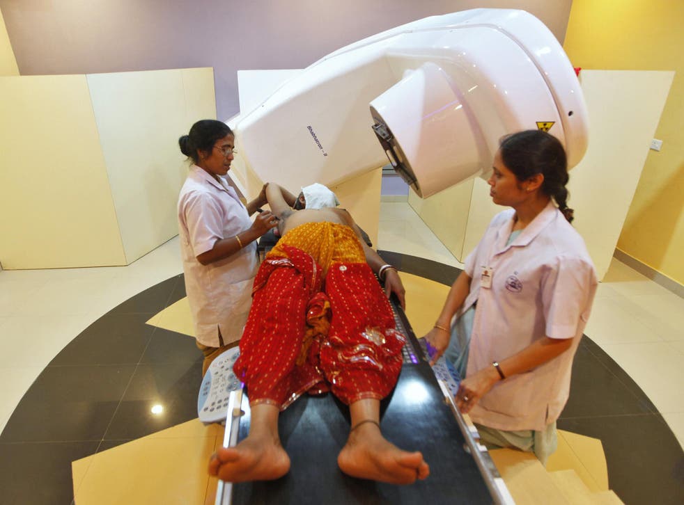 A nurse prepares a breast cancer patient before a gamma-ray test in Kolkata