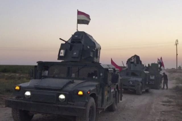 Iraqi soldiers on military vehicles in the Qatash area towards Kirkuk gas plant, south of Kirkuk