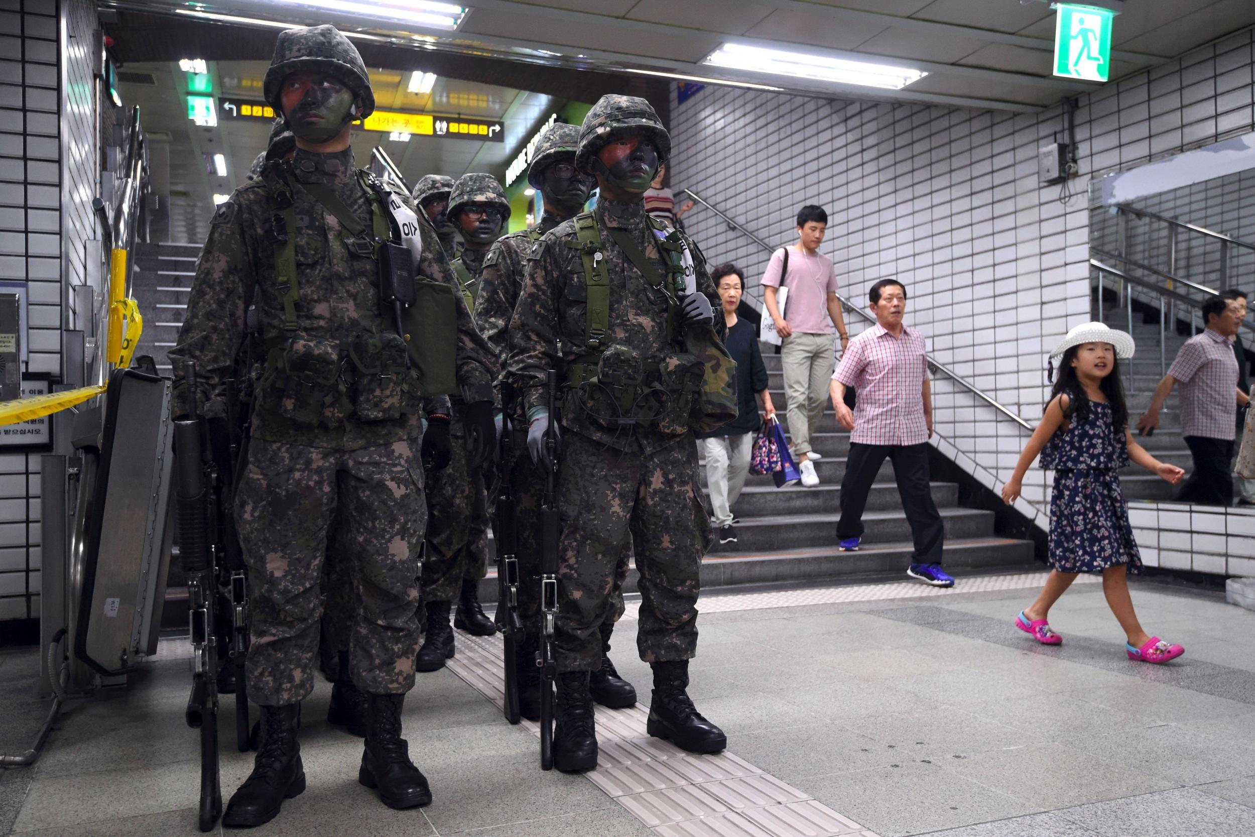 South Korean soldiers take part in an anti-terror drill at a subway station on the sidelines of a South Korea-US joint military exercise