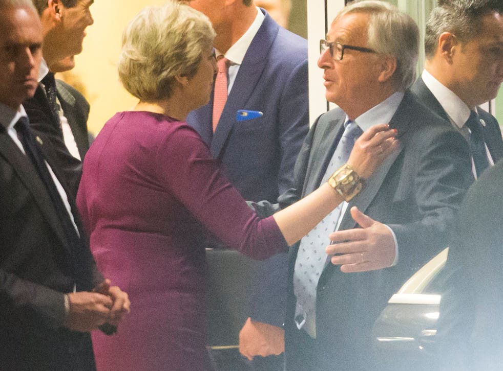 Theresa May and Jean-Claude Juncker at the end of a Brexit dinner-meeting in Brussels