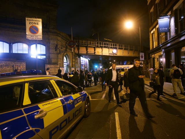 Police at the scene outside Parsons Green Tube station in London where three men were stabbed