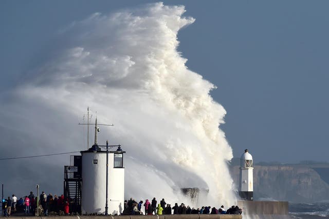 Waves crash over a lighthouse as Storm Ophelia passes Porthcawl. UK storms do cause damage and distress, but now they are being elevated into a big worry on a regular basis