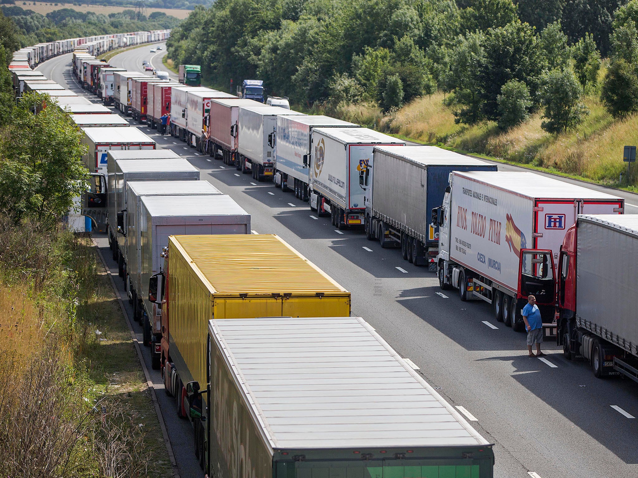 Lorries queue to reach the UK's border with Europe at Dover. Major disruption to imports and exports is expected unless a deal can be reached