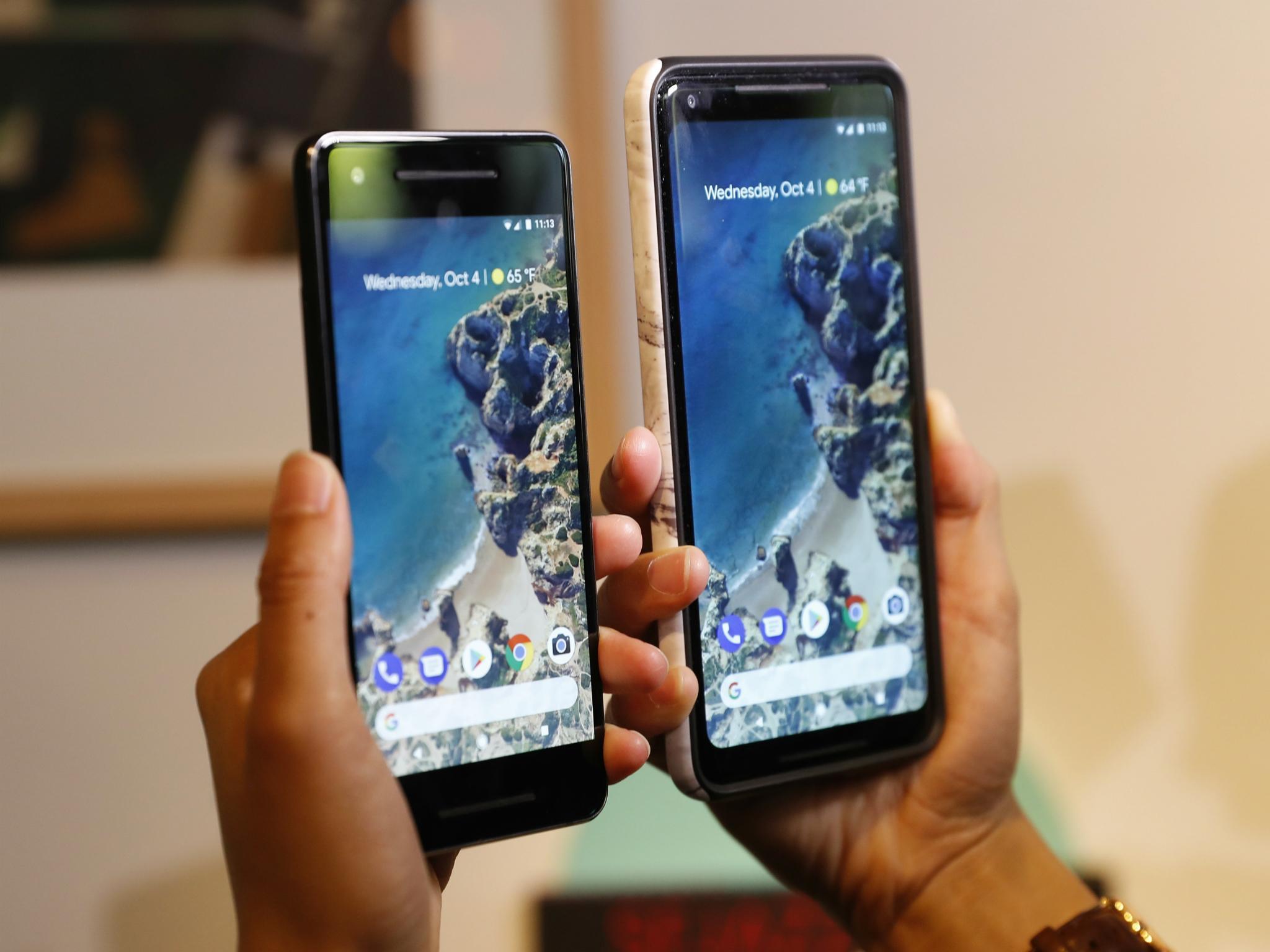 People compare Google phones during a launch event in San Francisco, California, U.S. October 4, 2017