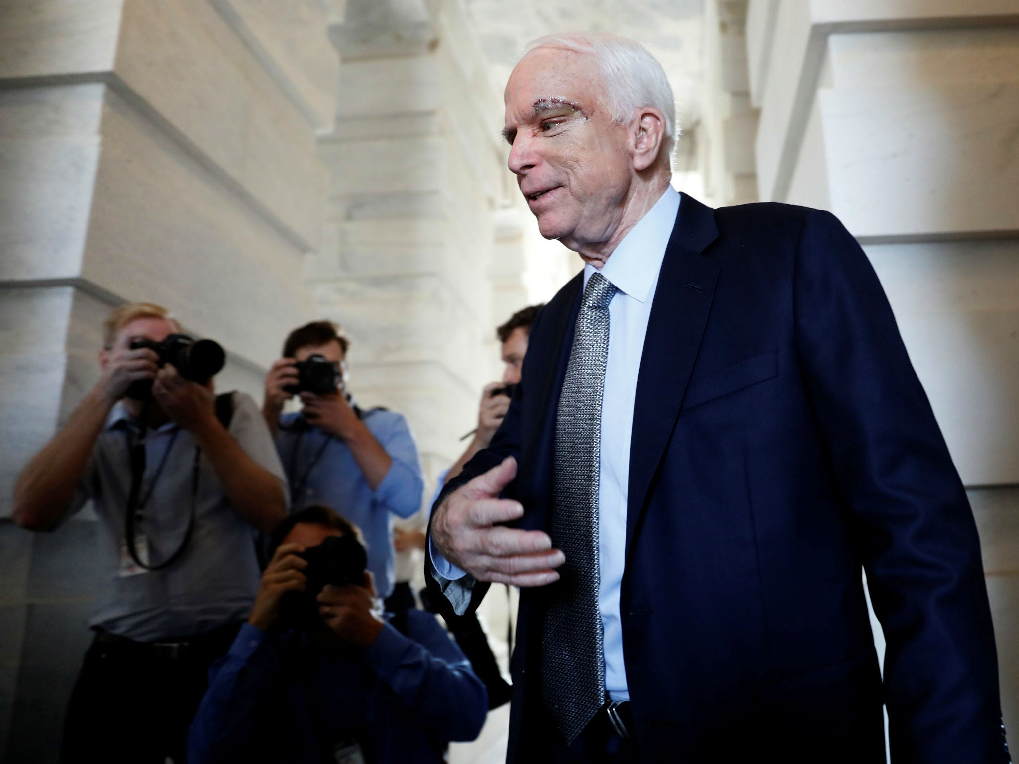 Senator John McCain, who had just been diagnosed with brain cancer, departs after returning to the Senate to vote on health care legislation in Washington on July 25, 2017