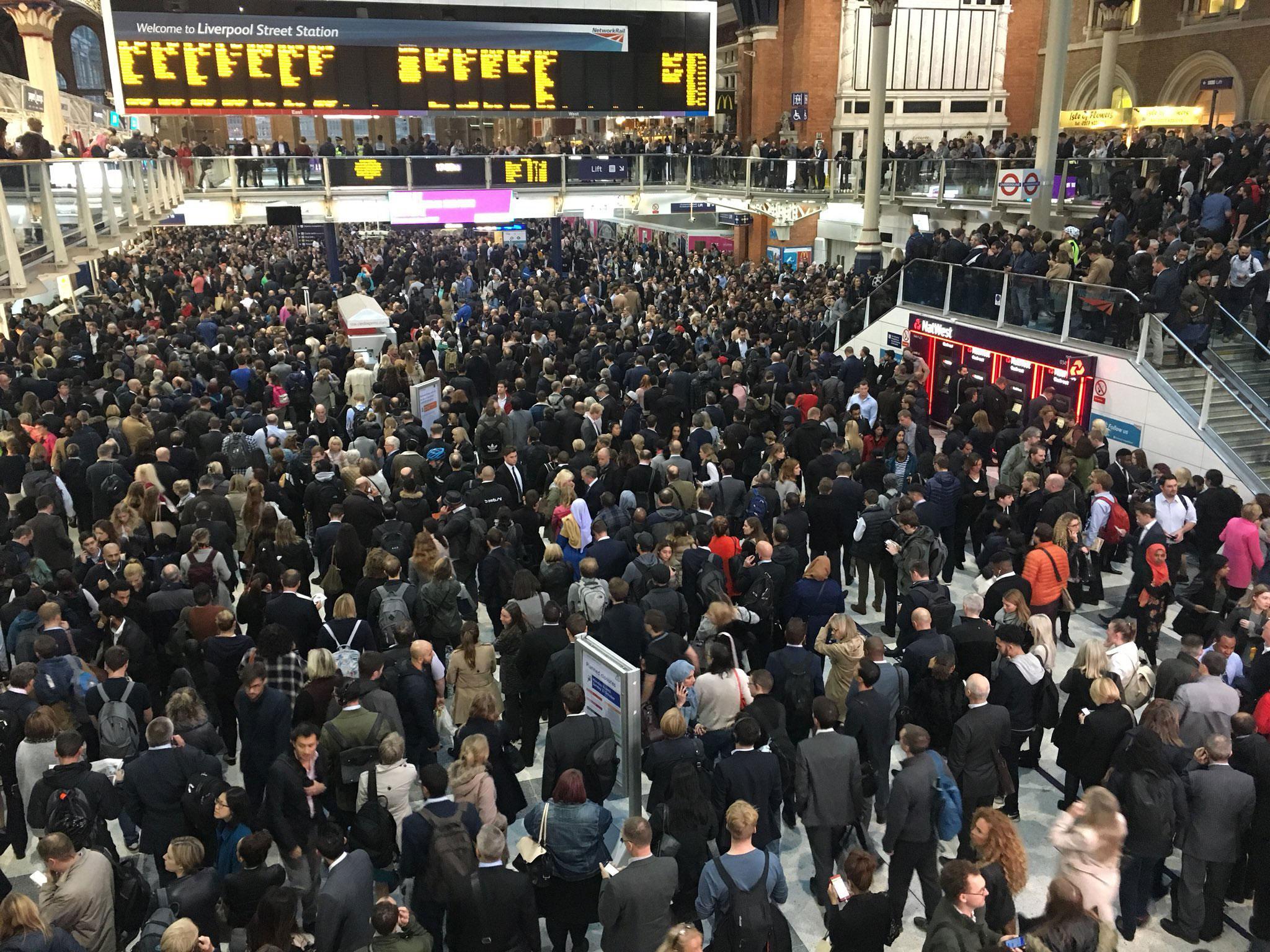 Commuters waited in the lobby of Liverpool Street station in central London