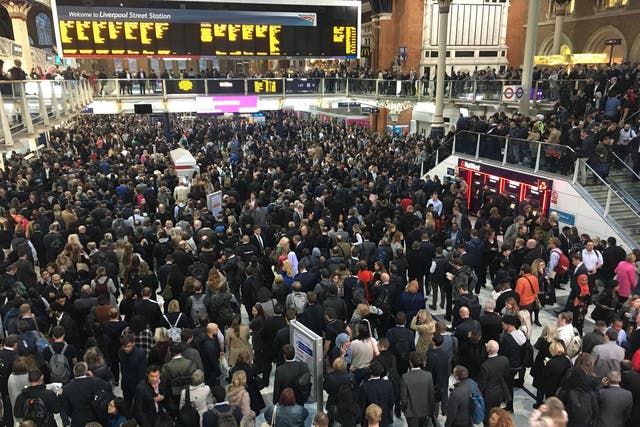 Commuters waited in the lobby of Liverpool Street station in central London