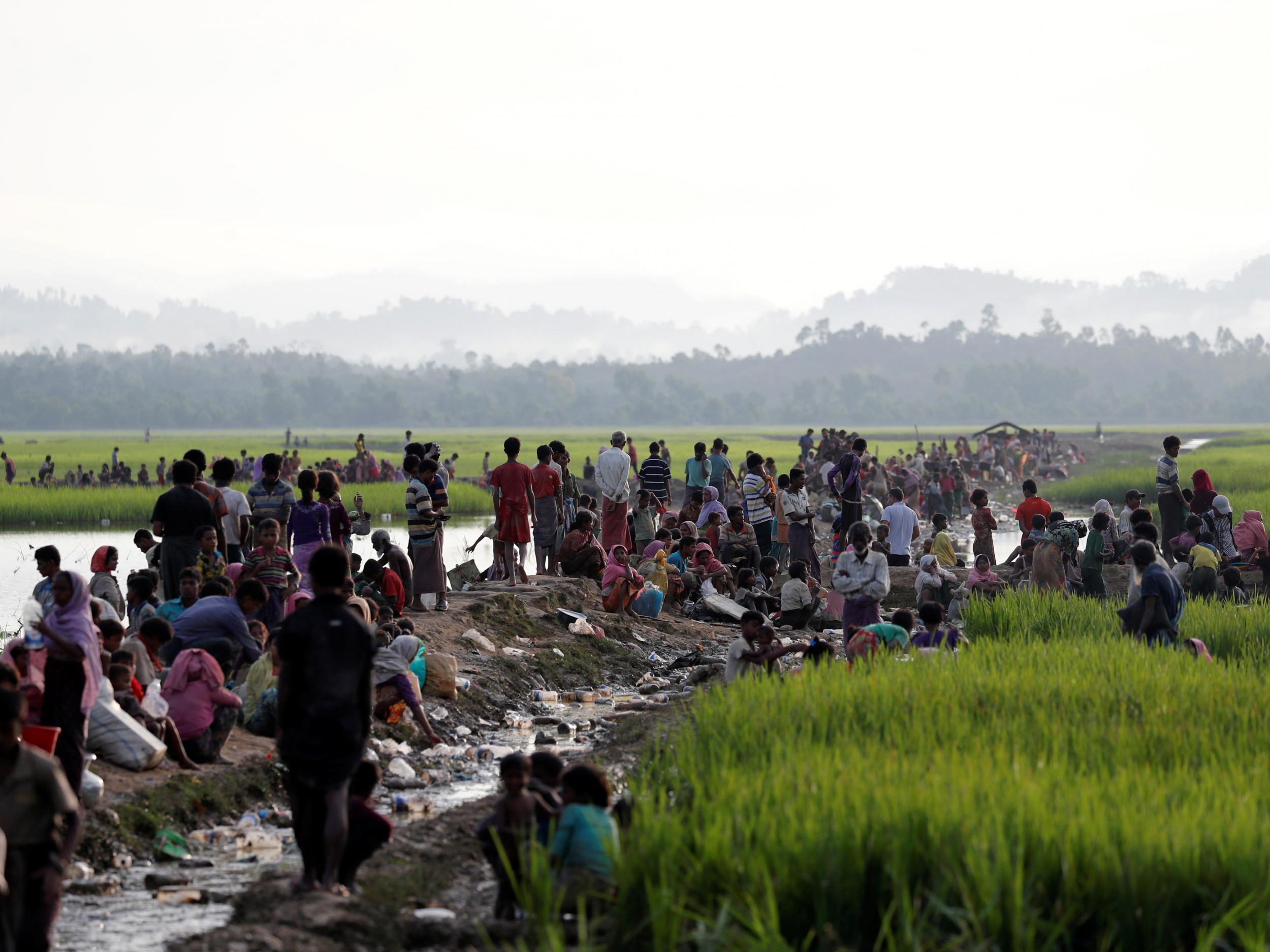 Rohingya refugees crossing the border into Bangladesh to escape persecution at home