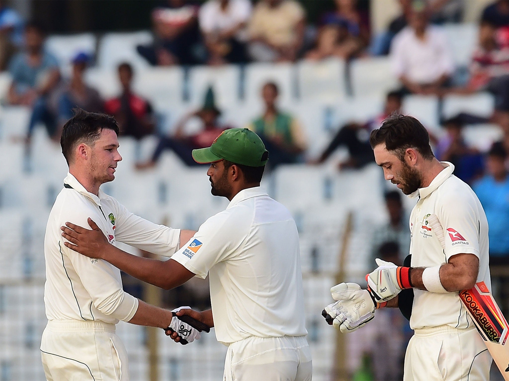Peter Handscomb is congratulated by the Bangladesh players as Australia win