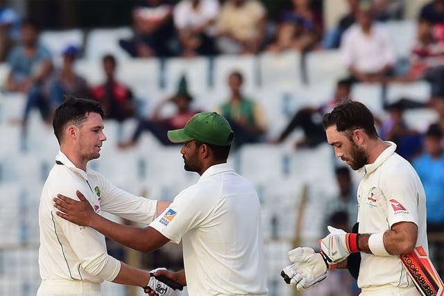 Peter Handscomb is congratulated by the Bangladesh players as Australia win