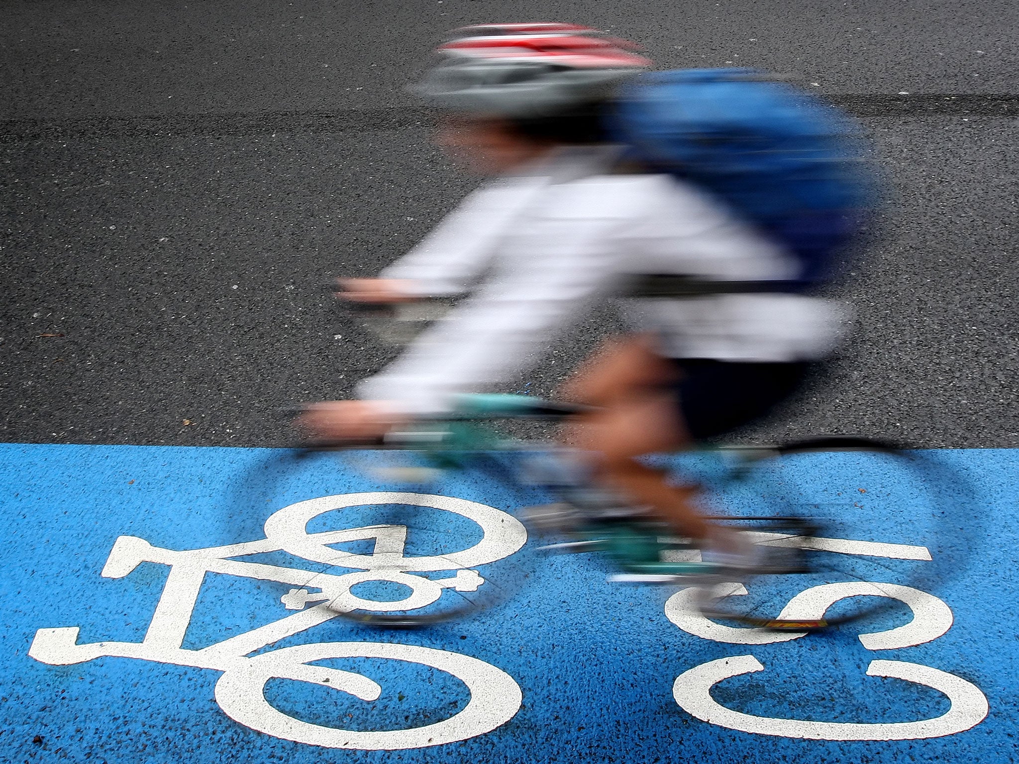 A cyclist rides on a cycle superhighway in Kennington, south London