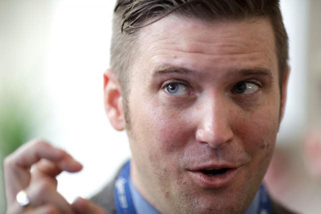 White supremacist Richard Spencer talks with reporters during the first day of the Conservative Political Action Conference