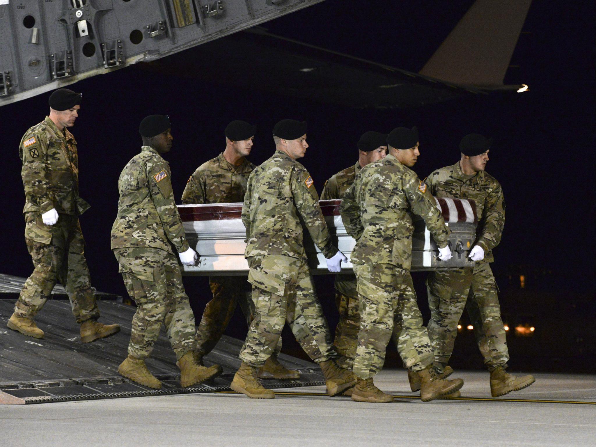 A US Army carry team transfers the remains of Sergeant Dustin Wright upon arrival at Dover Air Force Base, Delaware earlier this month