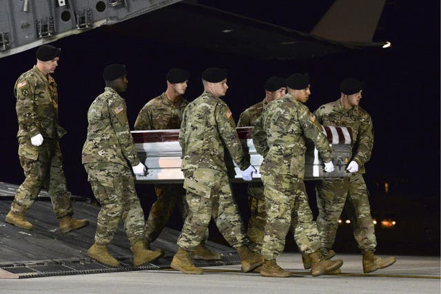 A US Army carry team transfers the remains of Sergeant Dustin Wright upon arrival at Dover Air Force Base, Delaware earlier this month