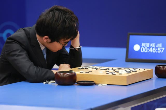 Chinese Go player Ke Jie reacts during his second match against Google's artificial intelligence program AlphaGo at the Future of Go Summit in Wuzhen, Zhejiang province, China May 25, 2017
