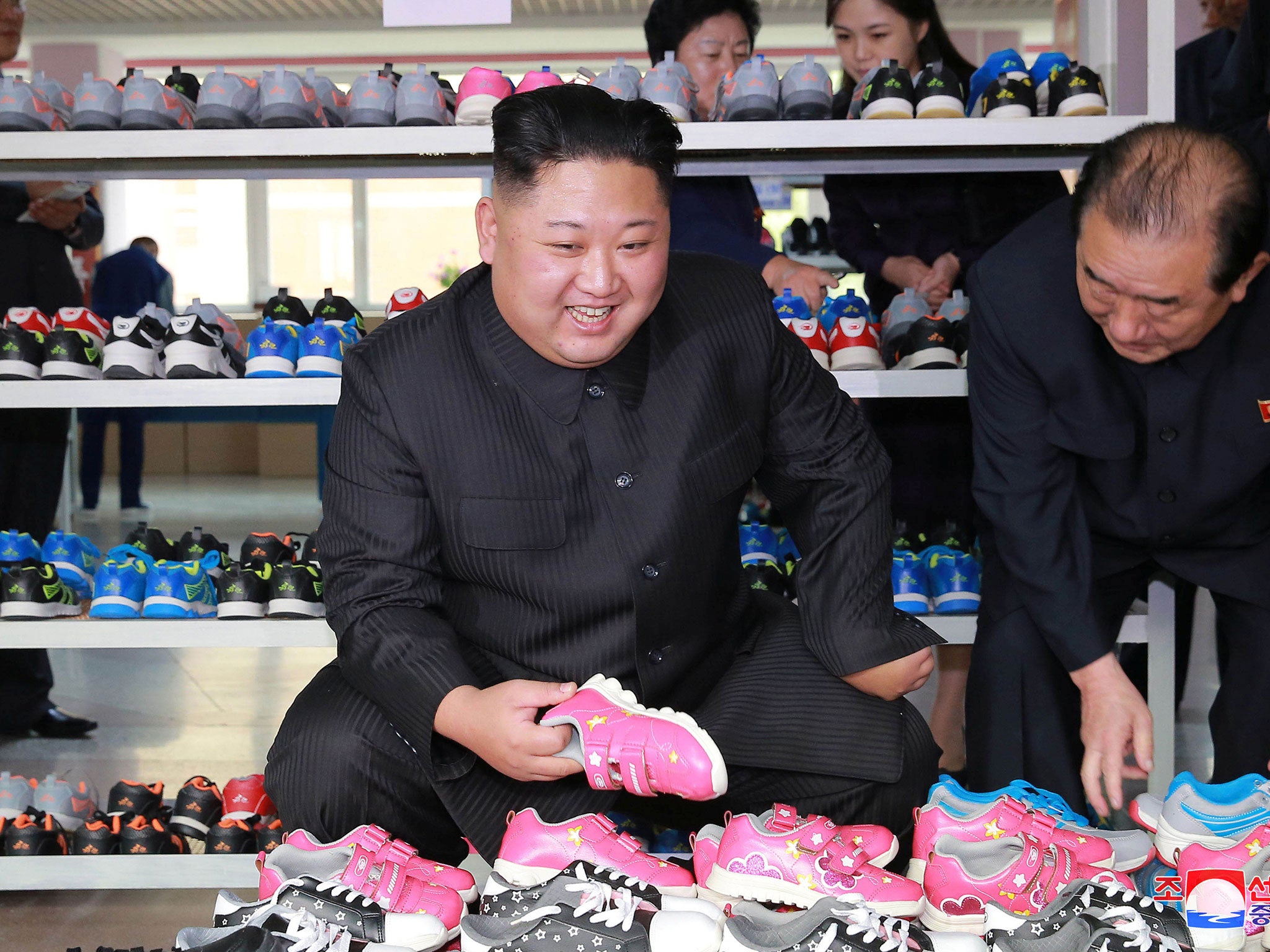 An image released by North Korea's news agency on Thursday shows Kim Jong-Un at a shoe factory