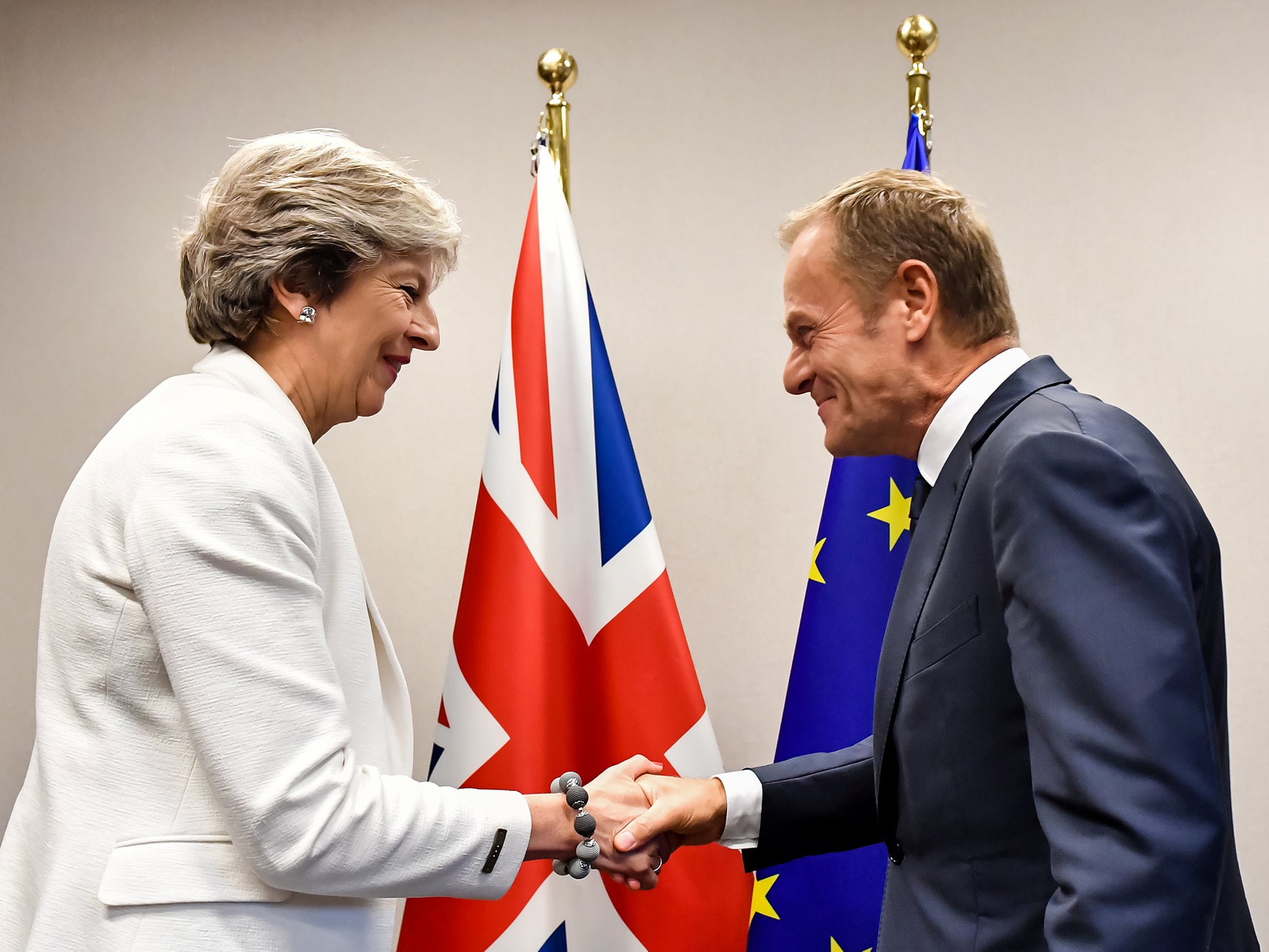 Theresa May shakes hands with European Council President Donald Tusk