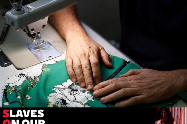 A worker sews clothes in a textile factory