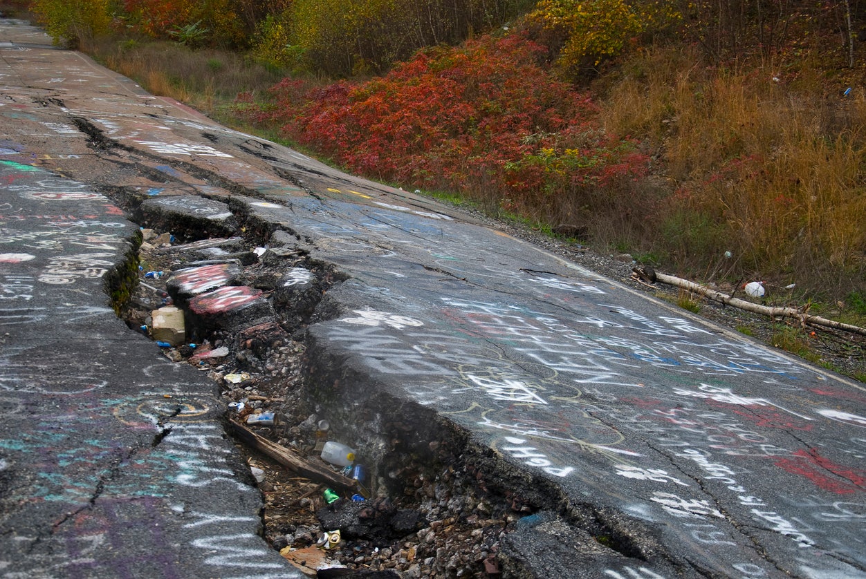 Street cracks in Centralia, Pennsylvania, caused by sulphuric gases. The town is now almost entirely abandoned (Getty)