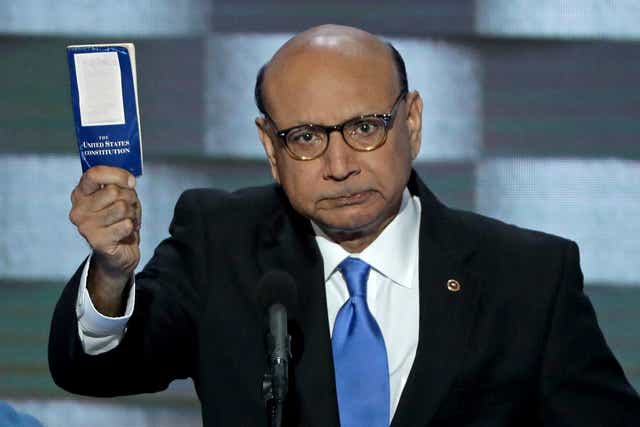 Khizr Khan, father of deceased Muslim US Soldier, holds up a booklet of the US Constitution as he delivers remarks on the fourth day of the Democratic National Convention