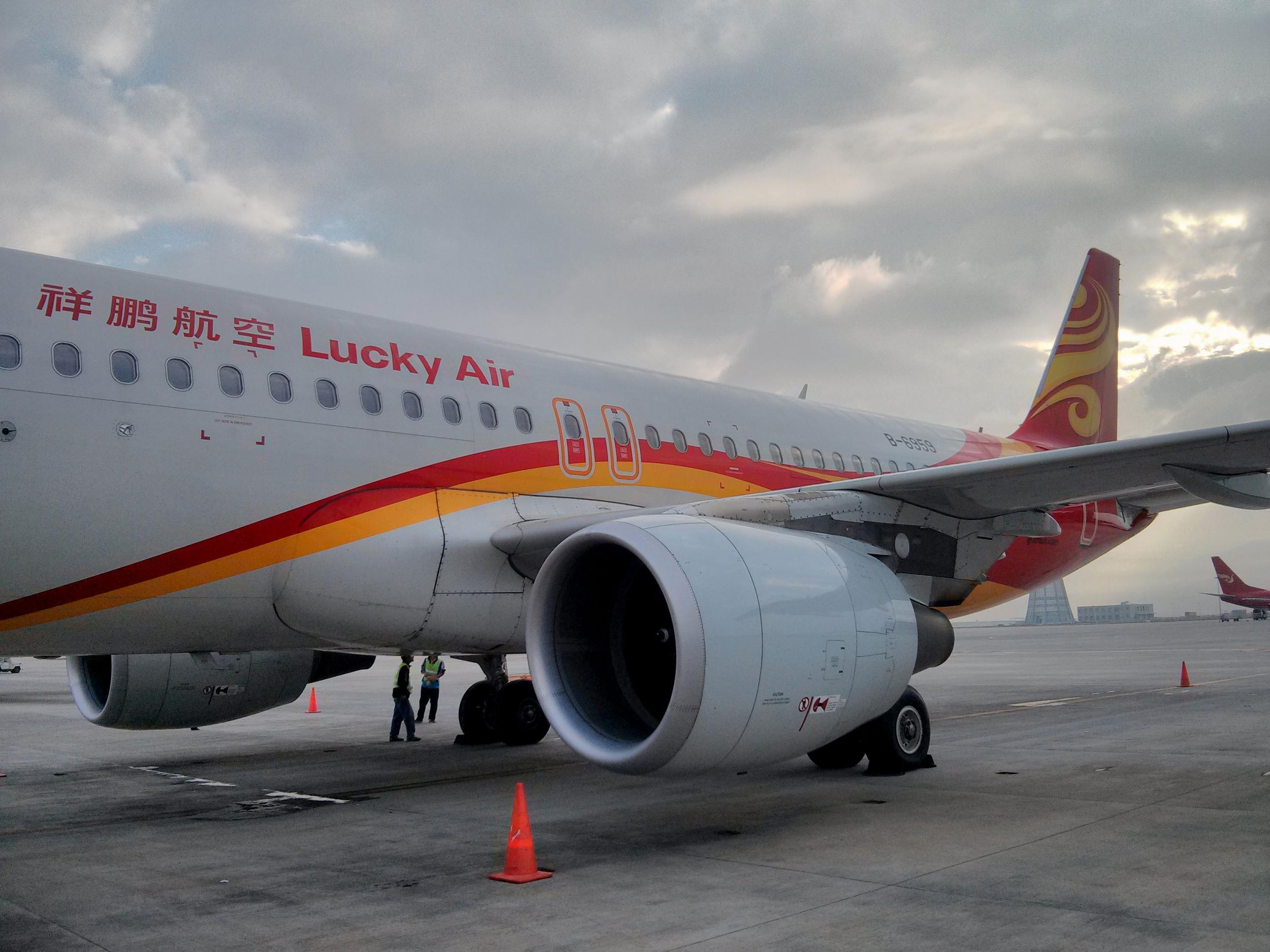 A Lucky Air flight was grounded after a passenger threw coins at the engine