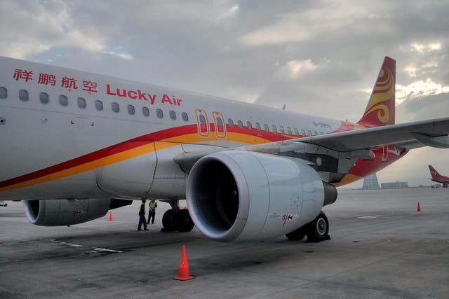 A Lucky Air flight was grounded after a passenger threw coins at the engine