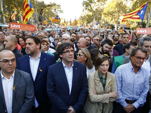Carles Puigdemont joined thousands at a march to protest against Mariano Rajoy’s speech
