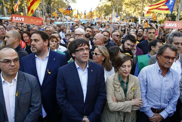 Carles Puigdemont joined thousands at a march to protest against Mariano Rajoy’s speech