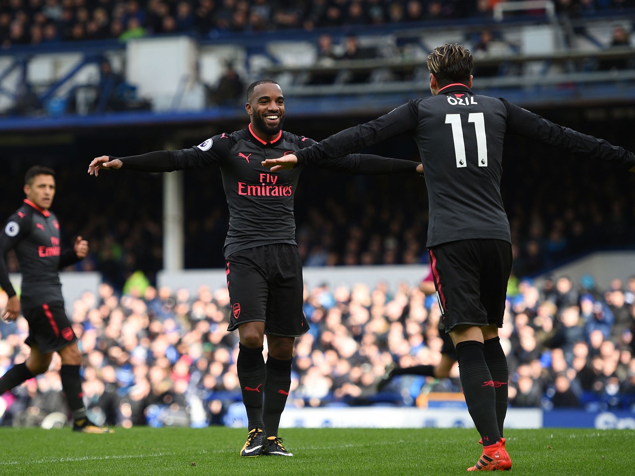 Alexandre Lacazette celebrates scoring Arsenal's third
