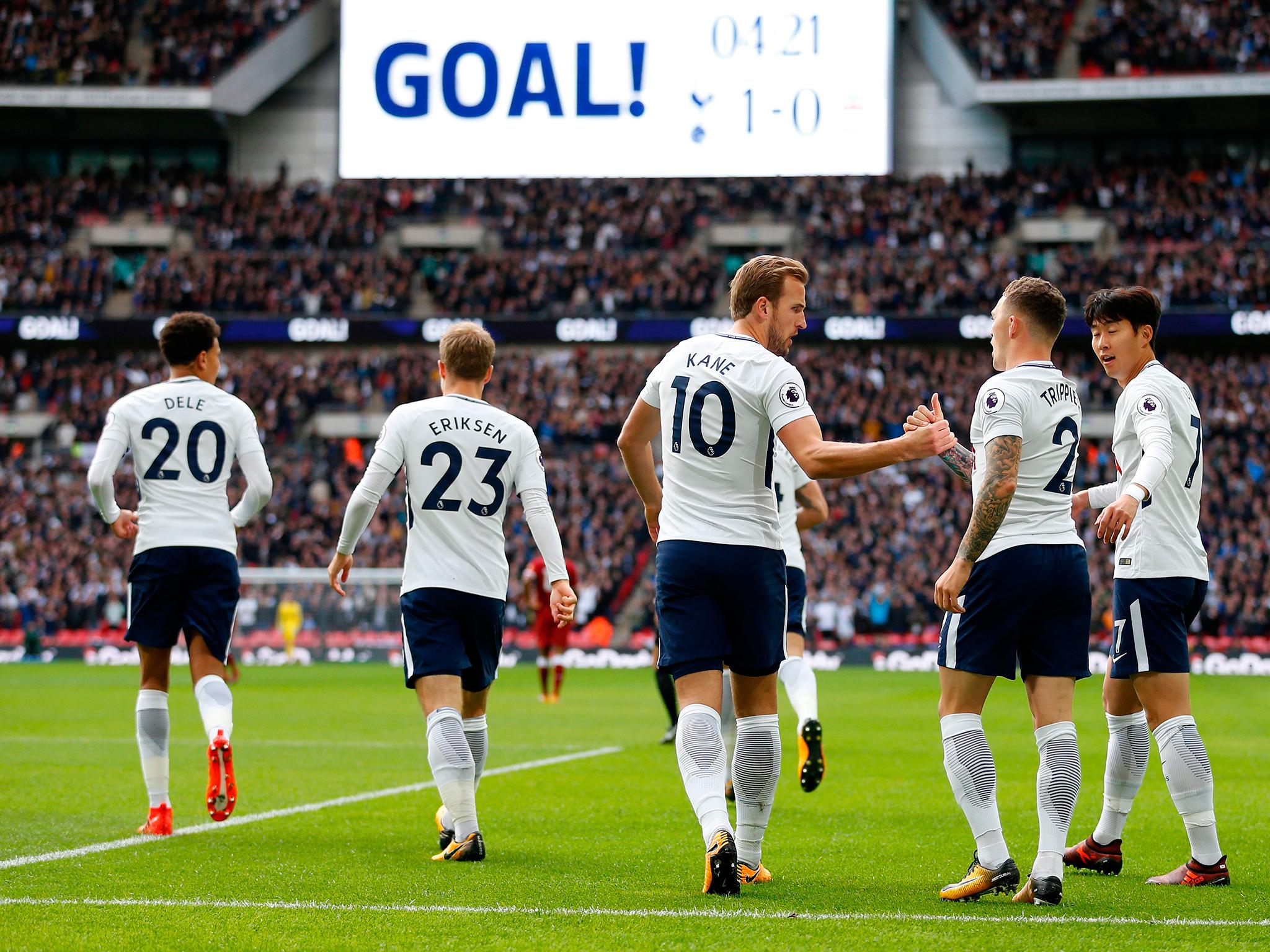 Tottenham players celebrate after Harry Kane's opening goal against Liverpool