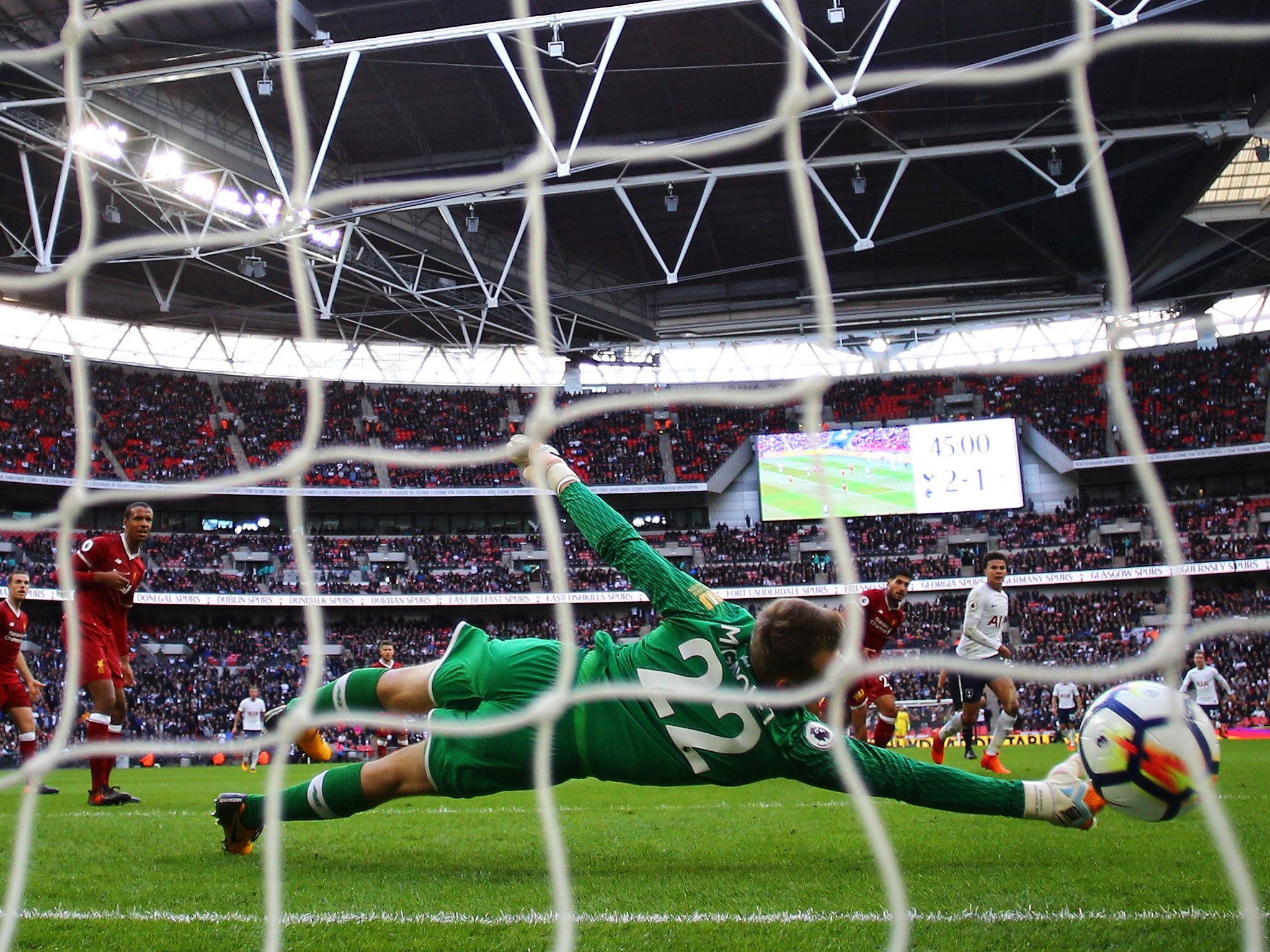 Simon Mignolet is beaten at his near post by Dele Alli