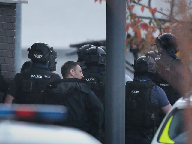 Armed police at the scene where a gunman is holding two bowling alley members of staff hostage