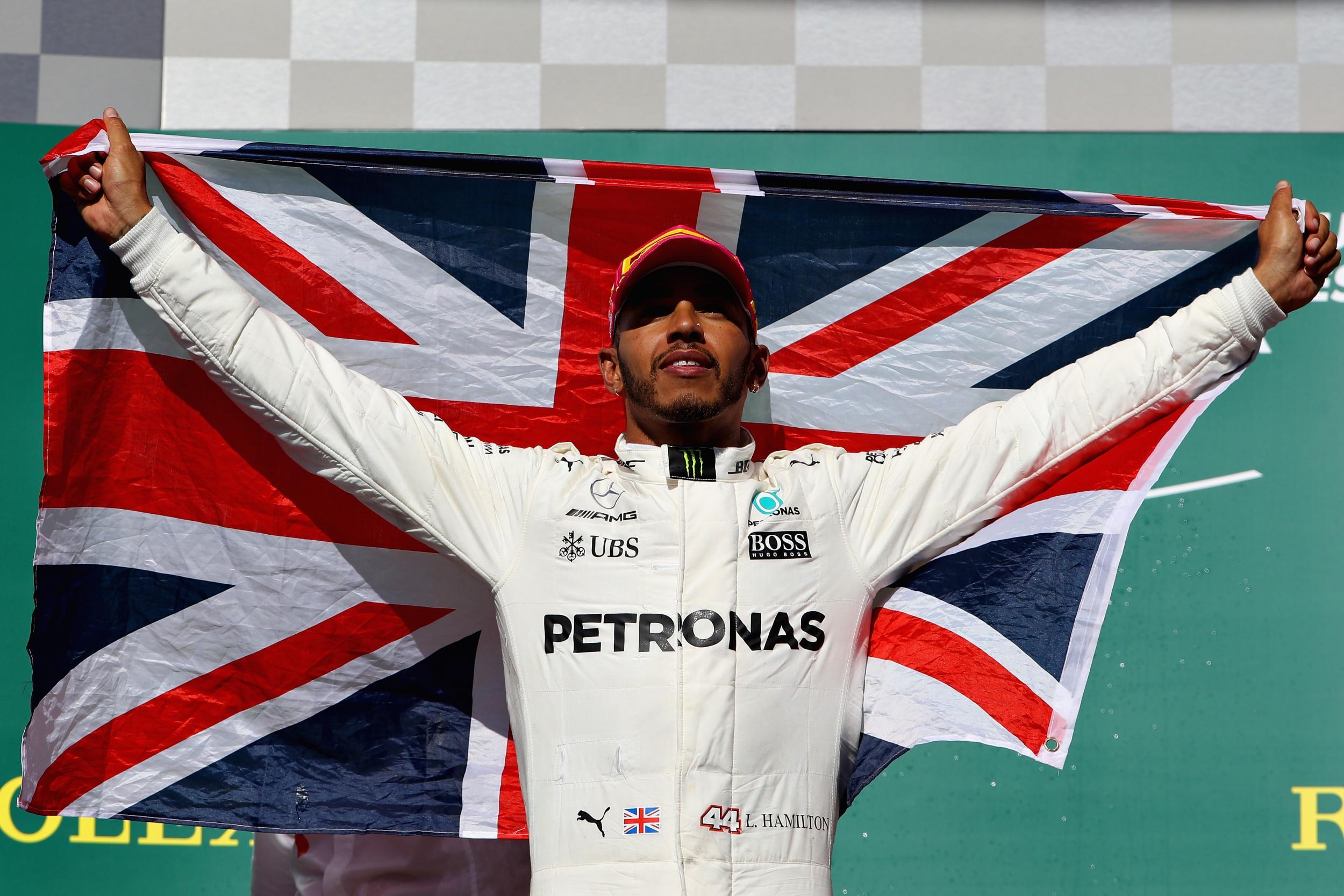 Lewis Hamilton on the podium after taking a step closer to the world title