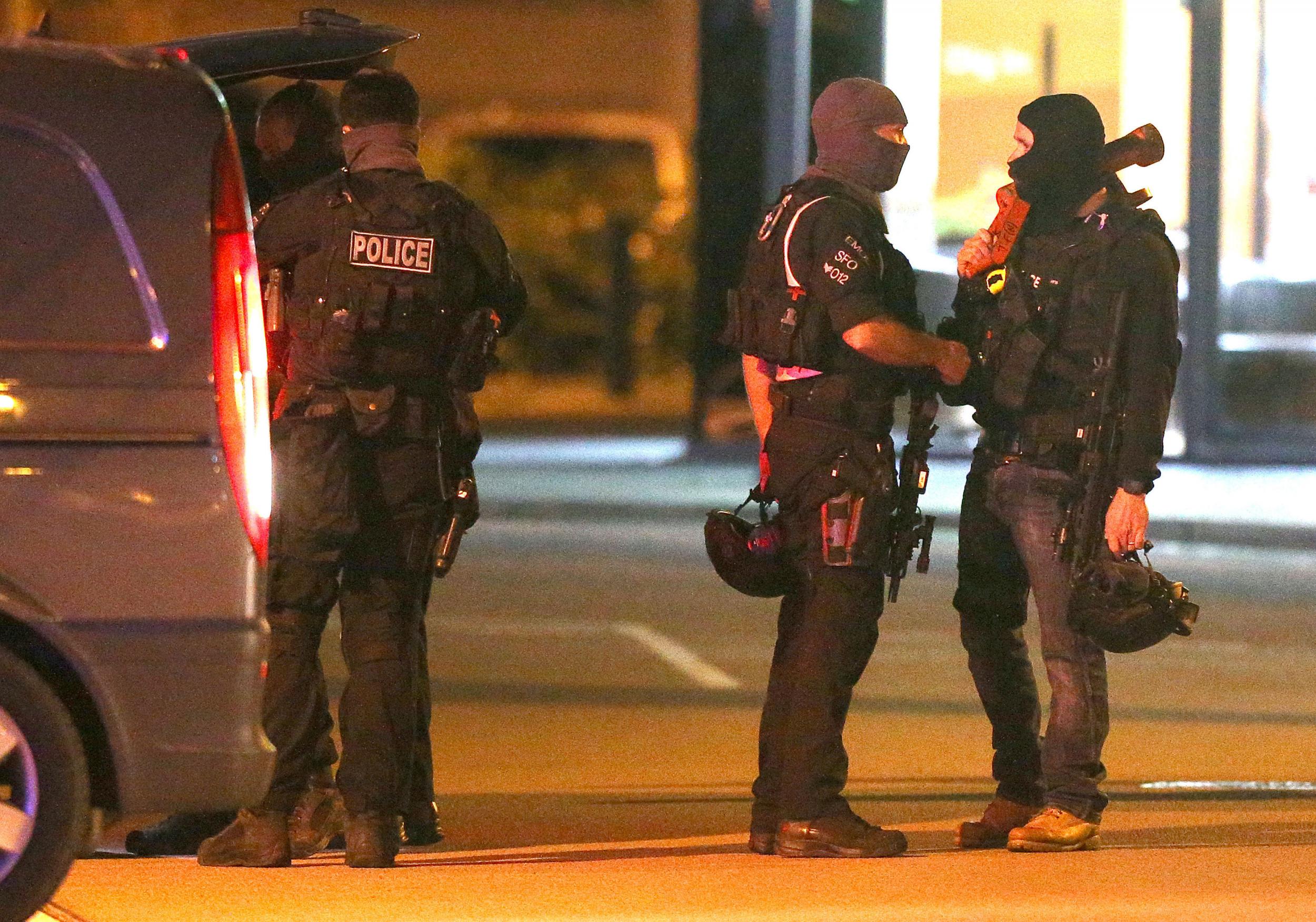 Armed police at the scene of the bowling alley where a gunman took people hostage
