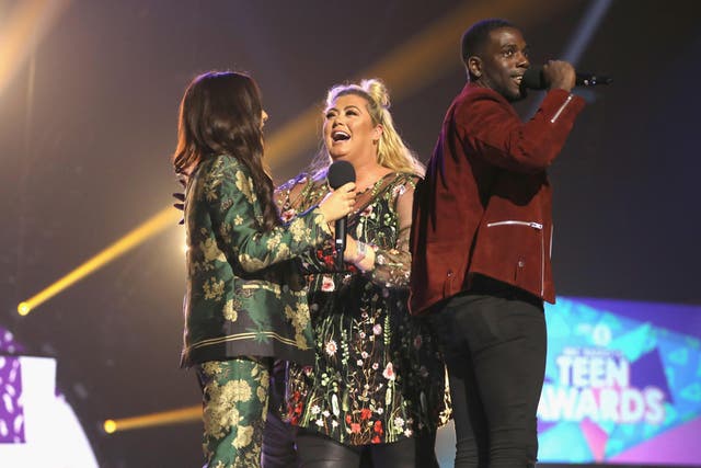 Amber Davies with Gemma Collins and Marcel Somerville on stage at the BBC Radio 1 Teen Awards