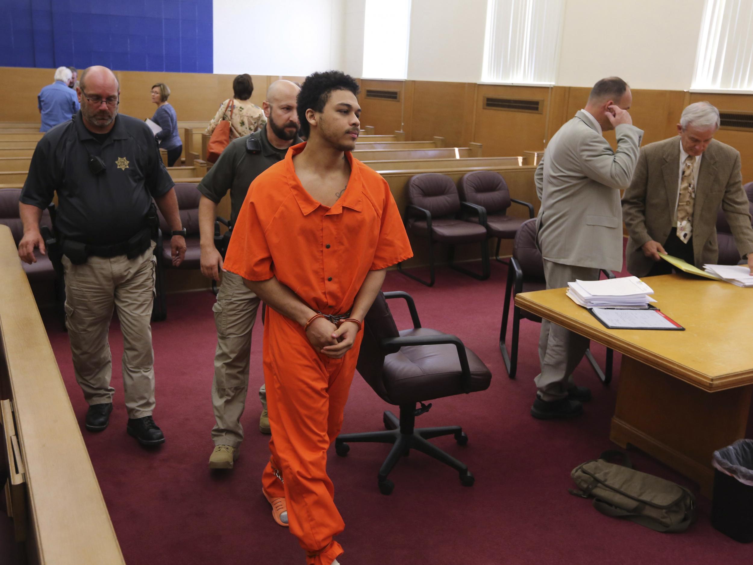 Jorge "Lumni" Sanders-Galvez, one of two men accused of killing Kedarie Johnson, 16, exits the courtroom following a hearing for his murder trial at the Des Moines County Courthouse in Burlington, Iowa